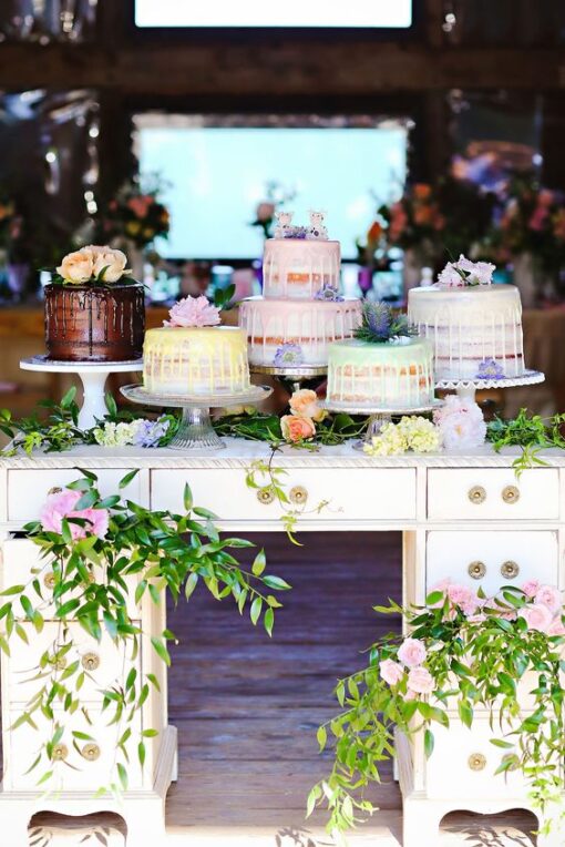 Ivory vintage desk with dessert cakes and florals