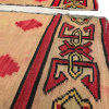 Side view of both rugs. Close up of border and red diamonds