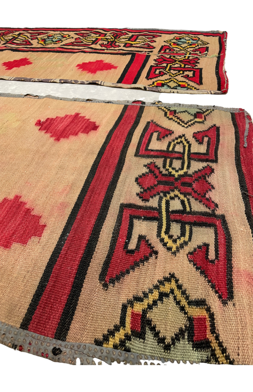 Side view of both rugs. Close up of border and red diamonds