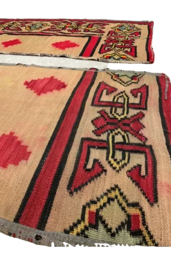 Side view of both rugs. Close up of border and red diamonds