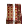 Pair of Maya boho runners. Formerly a full area rug, it has been cut into two strips. Thick border with geometric designs in yellow, green, and red. Large red diamonds in rows inside the border