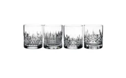 Collection of mismatched vintage cut glass tumblers with varied faceted and ribbed patterns, clear glass
