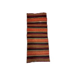 Boho runners with bold stripes in black, orange, red, yellow, and teal. Arial photo of a single runner.