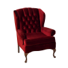 Deep red velvet wing back arm chair. Tufted back with cruved wooden legs.