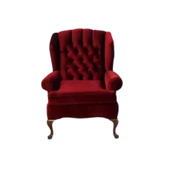 Front view of deep red velvet chair with tufted back, rolled arms, and curved wooden legs.