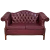 Maroon leather chesterfield sofa with tufted back, two cushions, and winged arms
