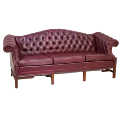 Side view of a maroon chesterfield sofa