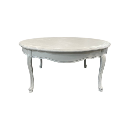 White round vintage coffee table with ornate legs.