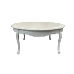 White round vintage coffee table with ornate legs.