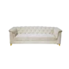 White velvet sofa with tufted back and rolling over the arms. One solid cushion on the seat. Gold feet.