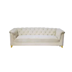White velvet sofa with tufted back and rolling over the arms. One solid cushion on the seat. Gold feet.