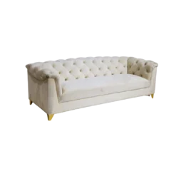White velvet sofa, side view. Tufted back that rolls over the arms. Solid long cushion.