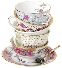 Mismatched teaccups/saucers. Stacked.
