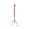 Copper colored ornate floor standing candlestick. Four feet on the floor curve into 1 solid stick with curved detail at the top. Holds 1 candle.