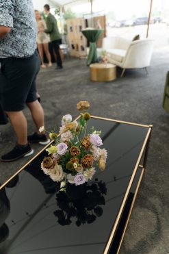 Black glass top rectangular coffee table with florals