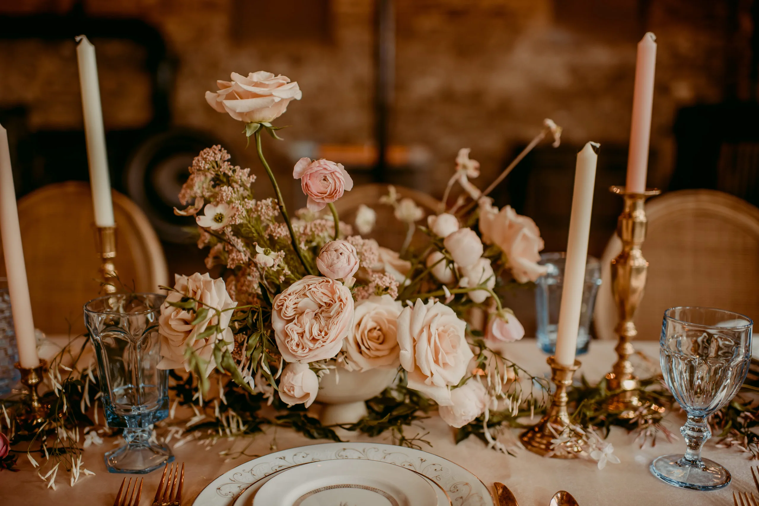 Wedding Reception table in Muncie with Celine plates WEBP Wedding reception table setting with china, blue goblets, candles and florals