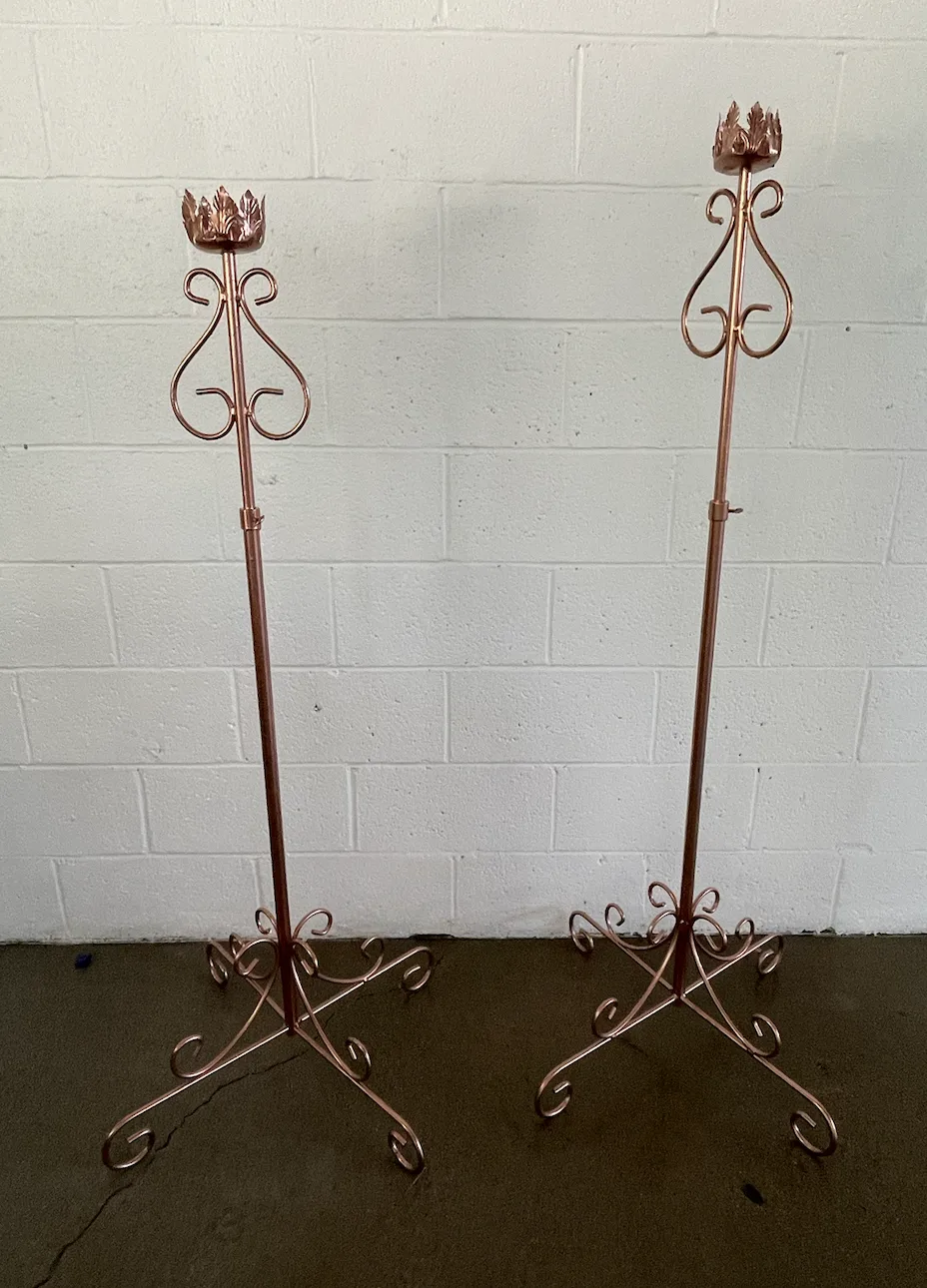 two floor standing candle sticks WEBP Two matching copper floor standing candle sticks