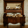 Desk and mantle used as dessert display at barn wedding at Wild Blackberry Farms