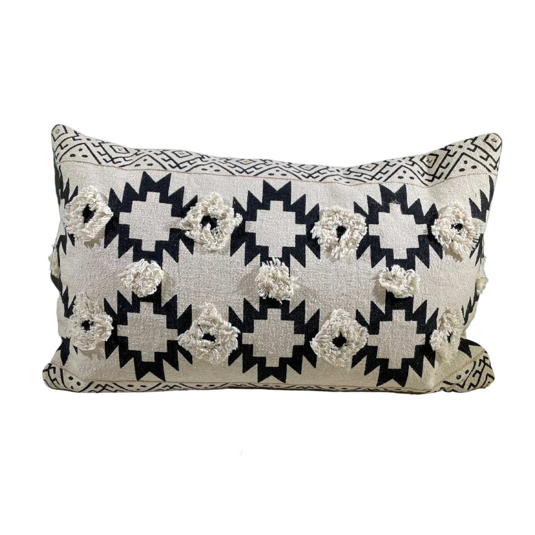 Addox Pillow WEBP Rectangular pillow with tan background and black southwest designs. Two rows of 3