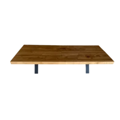 Mid century modern wood top rectangular coffee table in a warm stain. Metal legs from the center at an angle.