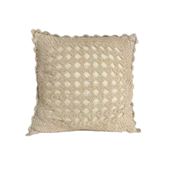 Square knit pillow in cream. Small open squares expose the pillow