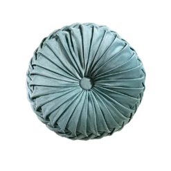 Stylish round pillow with velvet cover and button center. Fabric is bunched making rays out from the center.