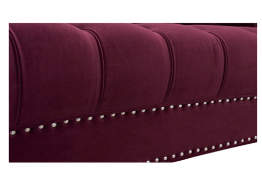 Close up on silver nailhead edging with velvet burgundy fabric