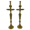 Tall gold decor shaped like a candlestick with a round plate 3/4 of the way to the top.