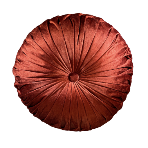 Burnt orange round velvet pillow with a button in the middle