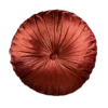 Burnt orange round velvet pillow with a button in the middle