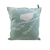 Sea-green pillow with a siloette of a bird on a bare branch in white.