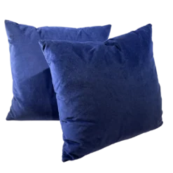 Navy velvet square pillows with a white background