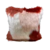 Square furry pillow with rust, white, and pink coloring