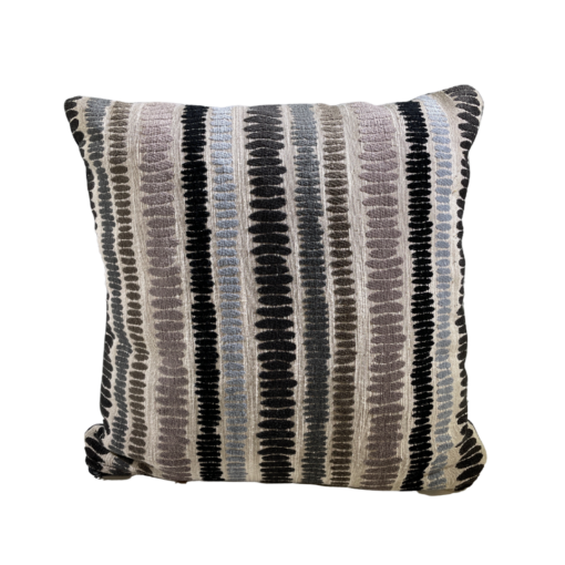 Striped pillow in beige with black, brown, tan, and light blue stripes