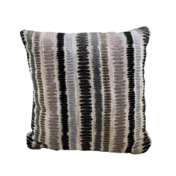 Striped pillow in beige with black, brown, tan, and light blue stripes