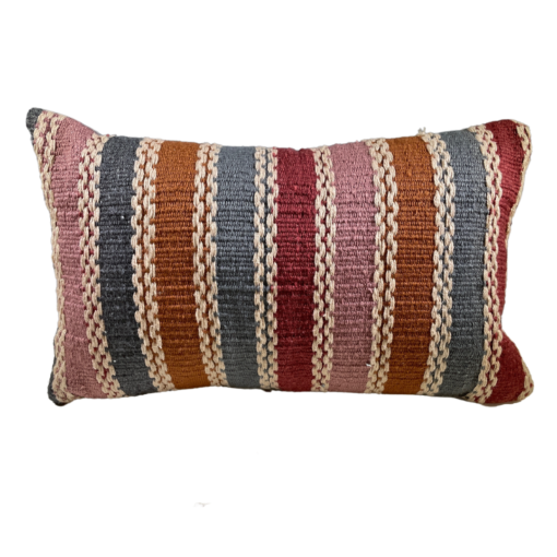 Rectangular pillow with bold stripes in pink, orange, blue, and burgandy