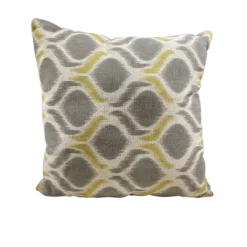 Beige square pillow with gray shapes and gray with yellow lines in between the shapes