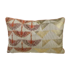 Rectangular pillow with gold shapes on the right and abstract bird designs on the left.
