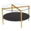 Gold X viewable under a round glass top. 4 gold legs and black round shelf.