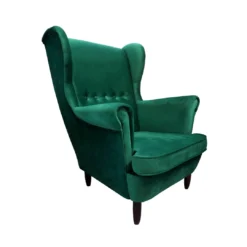 Hunter green velvet wingback armchair with high back, round arms, buttons in the middle, and 4 black legs