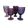 Assorted sizes, colors, and styles of purple goblets in different hues.