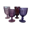 Assorted sizes, colors, and styles of purple goblets in different hues.