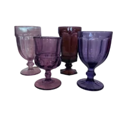 Assorted sizes, colors, and styles of purple goblets in different hues.