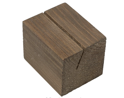 Dark wood block with an angled slit for holding signs