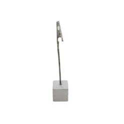 Silver. Square cube bottom with silver wire coming straight from the middle with a clip on the end to hold table numbers, seating assignments or food.