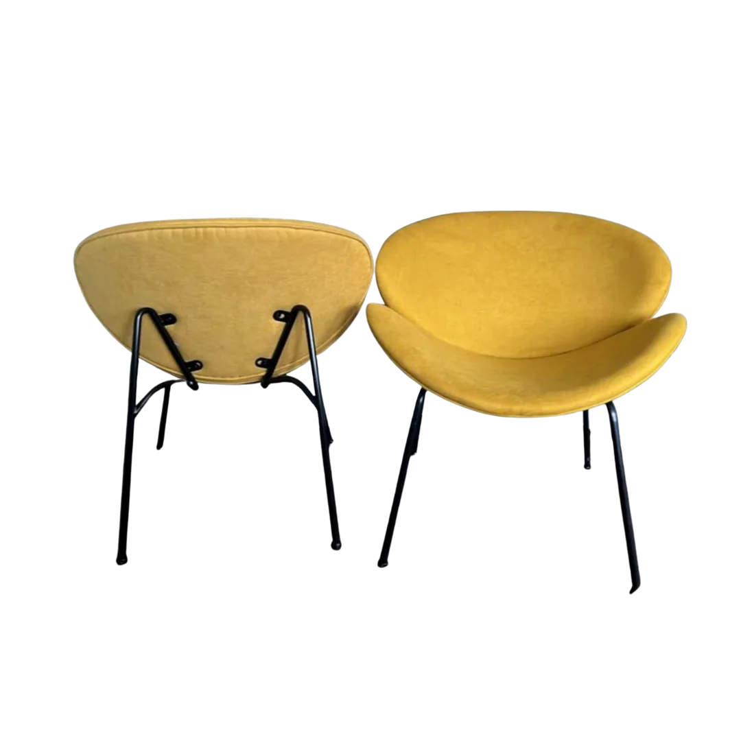 Amura Chairs front and back view WEBP Two mustard MCM chairs - one facing forward and one facing backwards