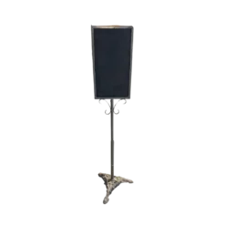 Black slate two sided chalkboard on a freestanding metal stand with ornate feet.