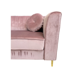 Close up on square arms, tufted back and round pillow