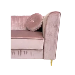 Close up on square arms, tufted back and round pillow