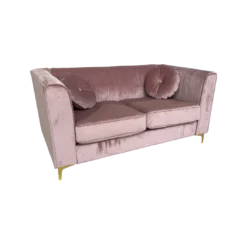 Soft pink velvet sofa with tufted back, two large cushions, square arms and gold legs. Includes two round matching pillows. Side view